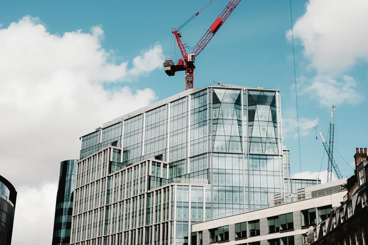 Corporate office tower construction with crane activity